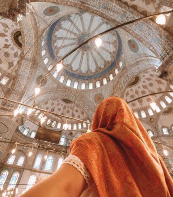 Girl looking up at the blue mosque