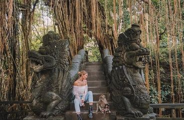 Posing with monkeys at monkey forest